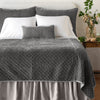 Silk Velvet Quilted Twin Coverlet | Fog | coverlet and matching shams on a neatly made, white bed - end of bed view.