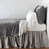 Silk velvet quilted coverlet with matching shams and white sheeting - fog, side view.