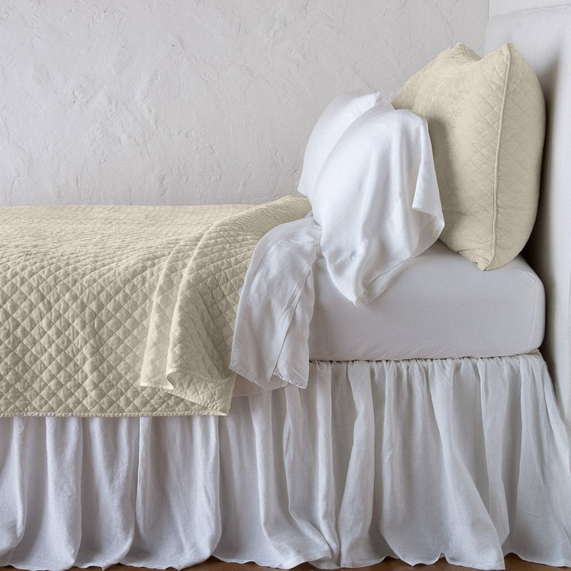 Silk Velvet Quilted Coverlet | Parchment | coverlet with matching shams and white sheeting - side view.