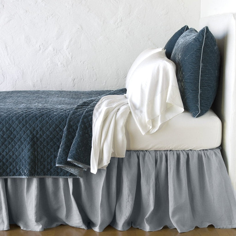 Mineral | Silk velvet quilted shams with matching coverlet and white sheeting - mineral, side view.