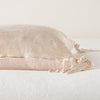 Taline Throw Pillow | Pearl | Close-up side vew featuring brass zipper with charmeuse pull and linen back.