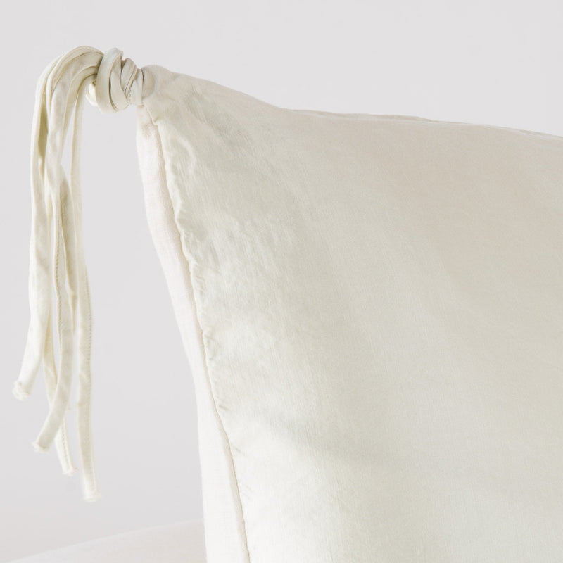 Taline Sham | Parchment | Corner detail close-up, highlighting hand-tied charmeuse tassel.