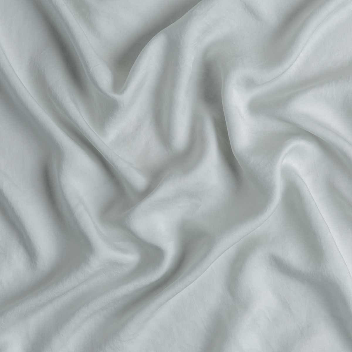 Tencel™ Swatch Card | Cloud | A close up of tencel™ fabric in cloud, a soft, subtle sky blue-grey.