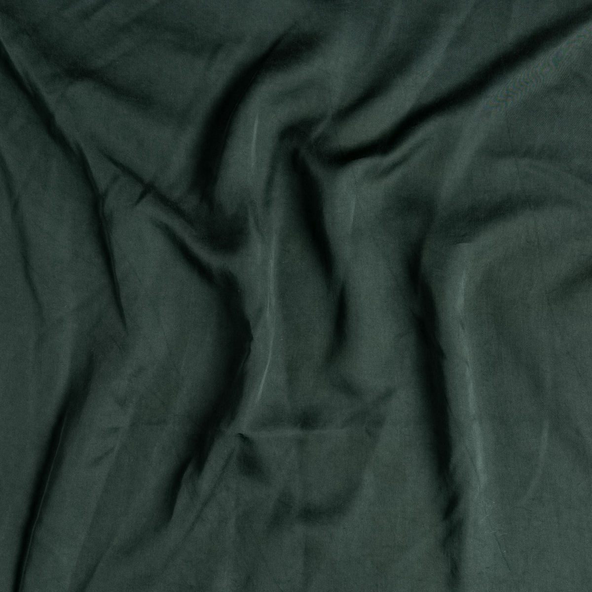 Tencel™ Swatch Card | Juniper | A close up of tencel™ fabric in Juniper, a deep green tone.