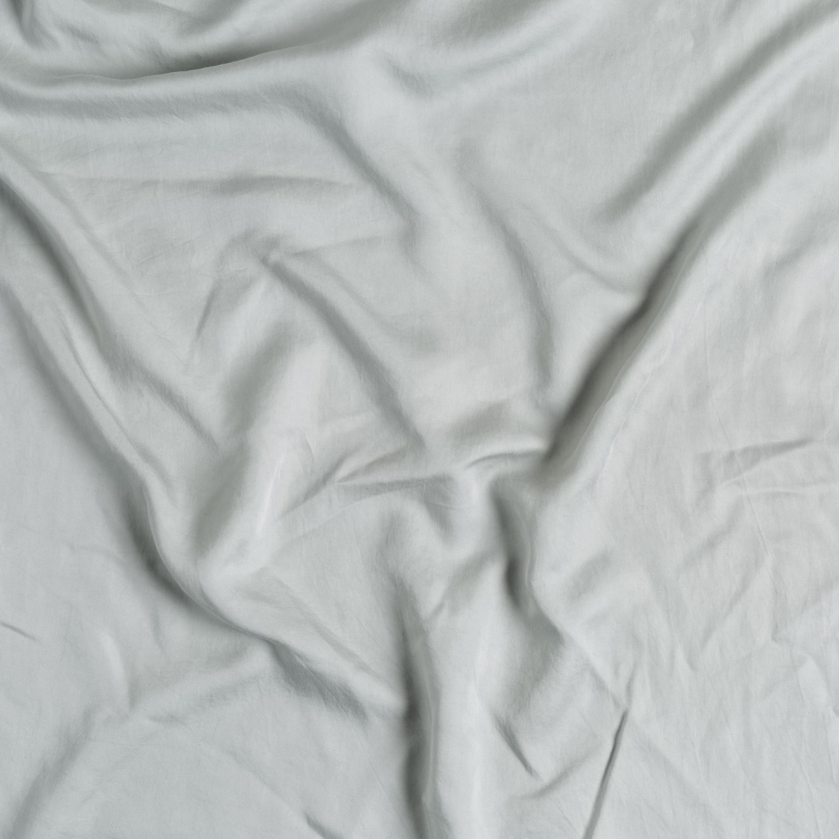 Tencel™ Swatch Card | Mineral | A close up of tencel™ fabric in mineral, a soothing seafoam blue with subtle grey-green undertones.