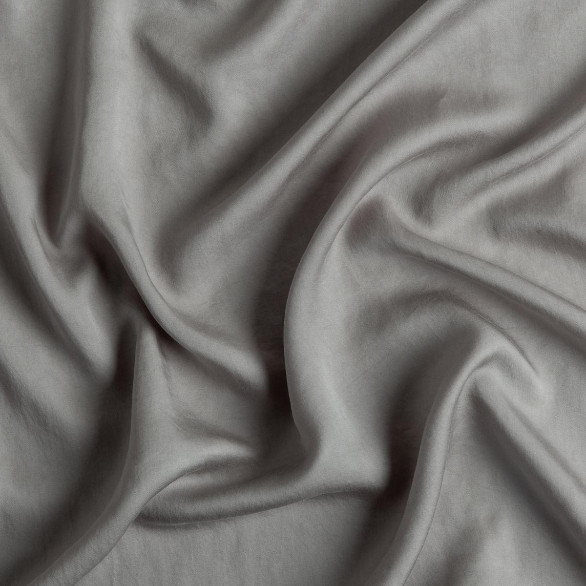 Tencel™ Swatch Card | Moonlight | A close up of tencel™ fabric in moonlight, a saturated, cool, mid-dark grey tone.