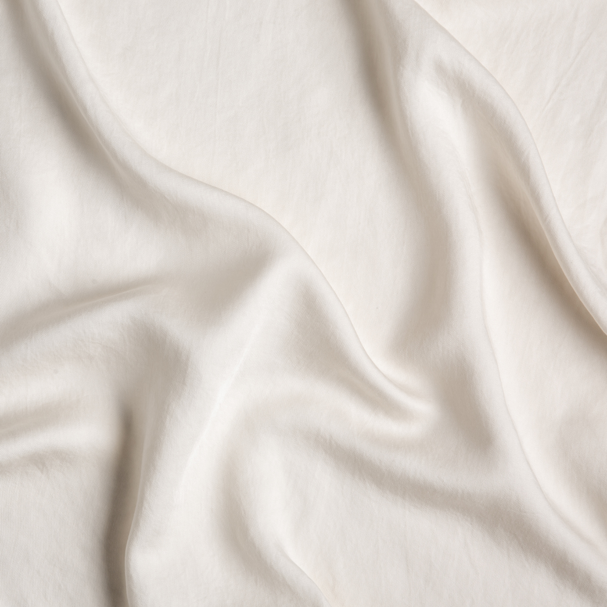 Tencel™ Swatch Card | Parchment | A close up of tencel™ fabric in parchment, a warm, antiqued cream.