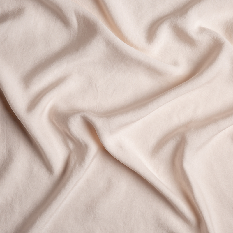 Tencel™ Swatch Card | Pearl | A close up of tencel™ fabric in pearl, a nude-like, soft rose pink tone.