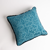 Vienna Throw Pillow | Cenote | cotton chenille jacquard 18x18 pillow shown from overhead to display the pillow's face and silk velvet trim — overhead against a white background.