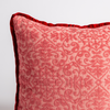 Poppy | a close up of a vienna throw pillow corner, showing trim and pattern detail — straight on against a white background.