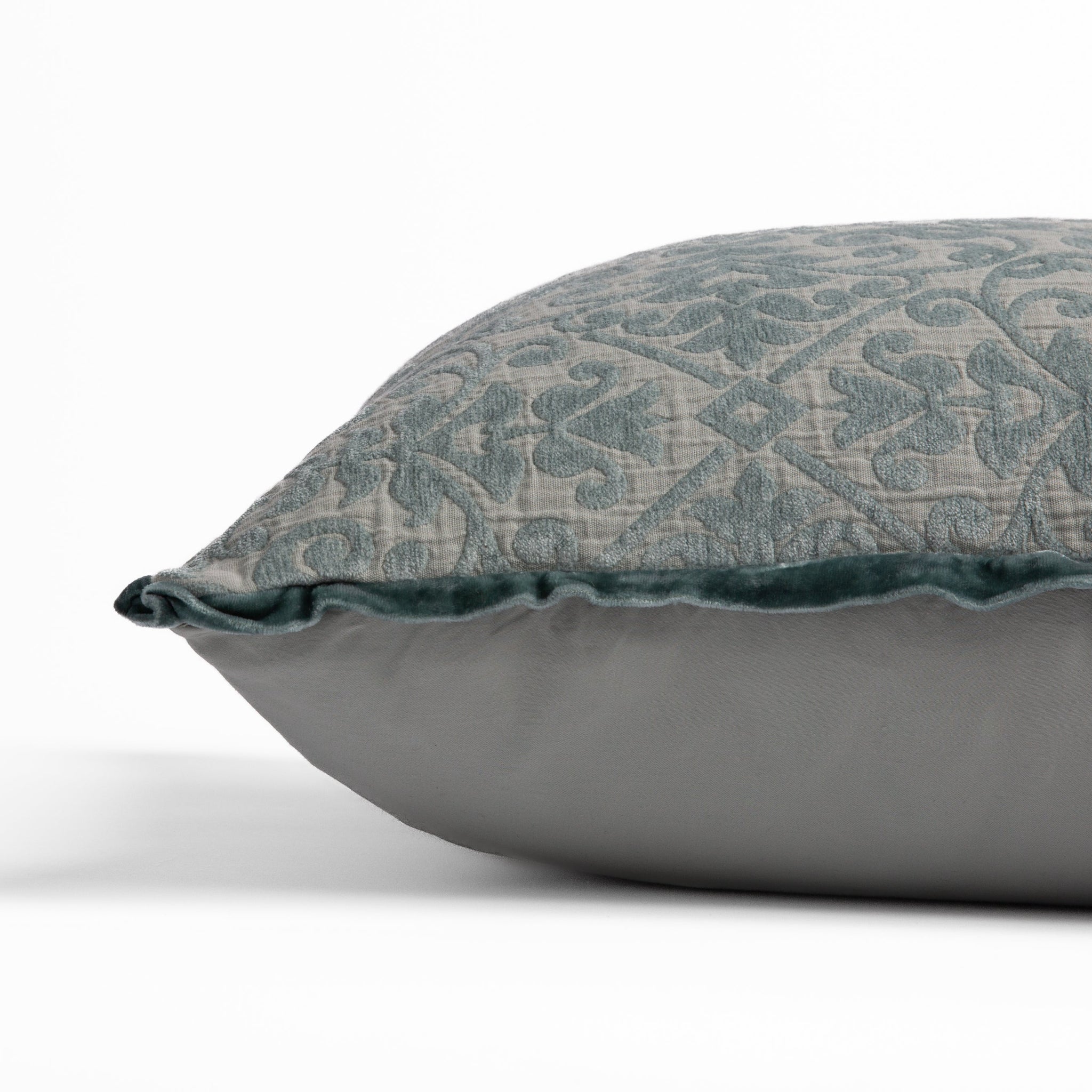 Vienna Throw Pillow | side view of 18x18 pillow shows cotton sateen back and silk velvet trim detail — close up against a white background. 