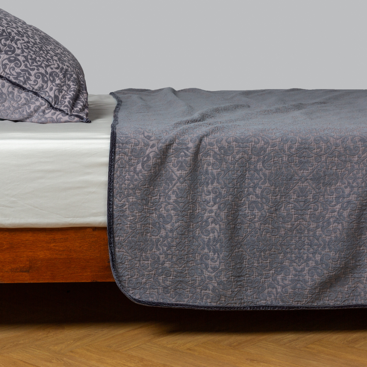 Vienna Twin Coverlet | French Lavender | cotton chenille coverlet and matching sham - side view.