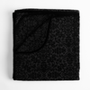 Vienna Blanket | Corvino | folded blanket with corner folded down to show reverse side of blanket and silk velvet trim.
