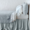 Vienna Twin Coverlet | Cloud | Vienna coverlet and matching sham over white sheeting - cloud, side view.