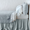 Vienna Twin Coverlet | Vienna coverlet and matching sham over white sheeting - cloud, side view.