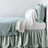 Vienna Twin Coverlet | Eucalyptus | Cotton chenille jacquard coverlet and matching sham over white sheeting - side view.