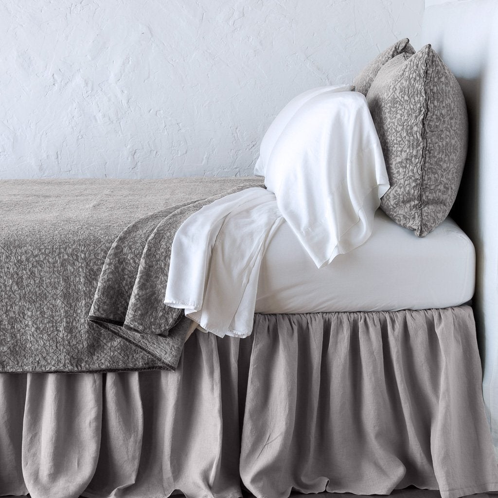 Vienna Twin Coverlet | Fog | Cotton chenille jacquard coverlet and matching sham over white sheeting - side view.