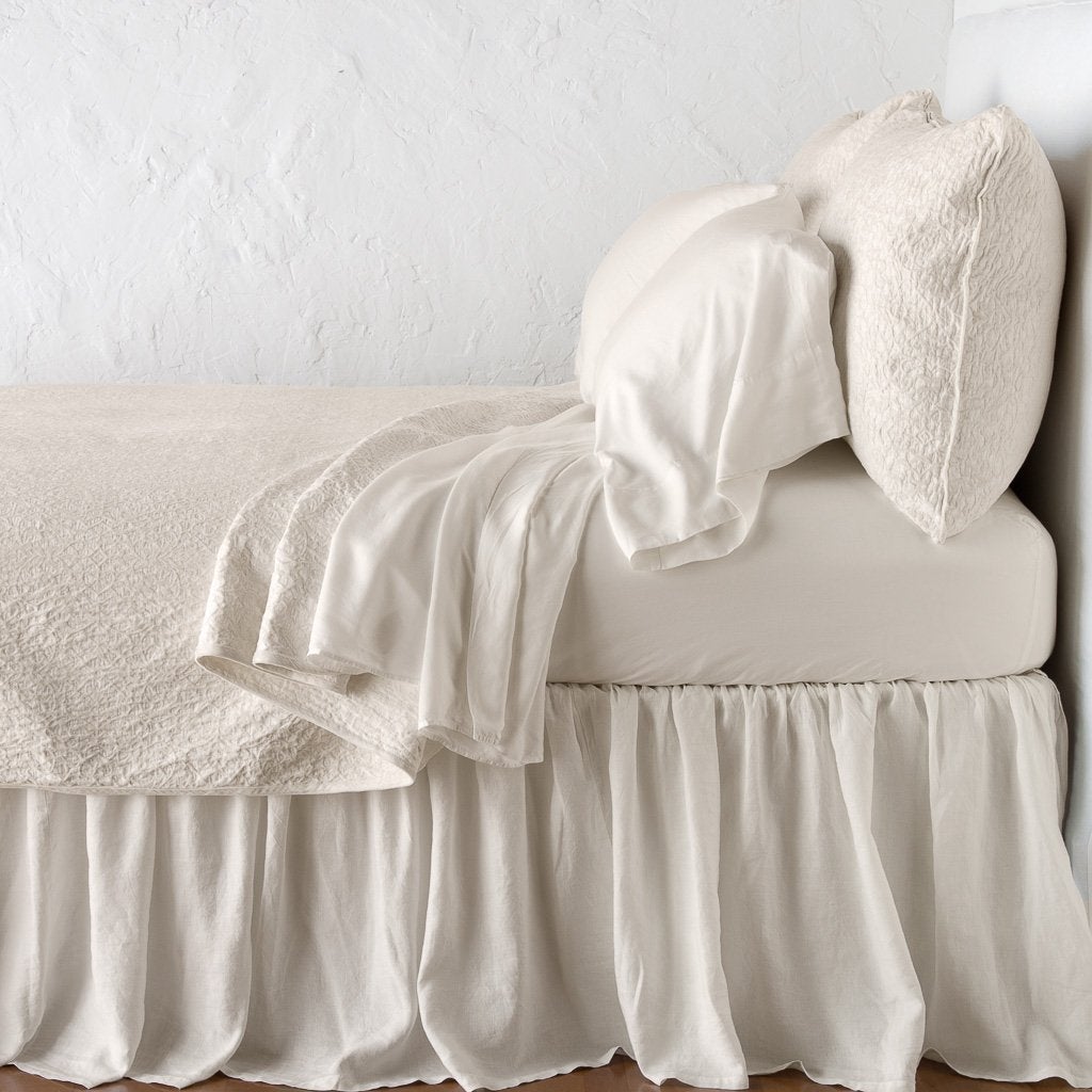 Vienna Coverlet | Parchment | Cotton chenille jacquard coverlet and matching sham over white sheeting - side view.