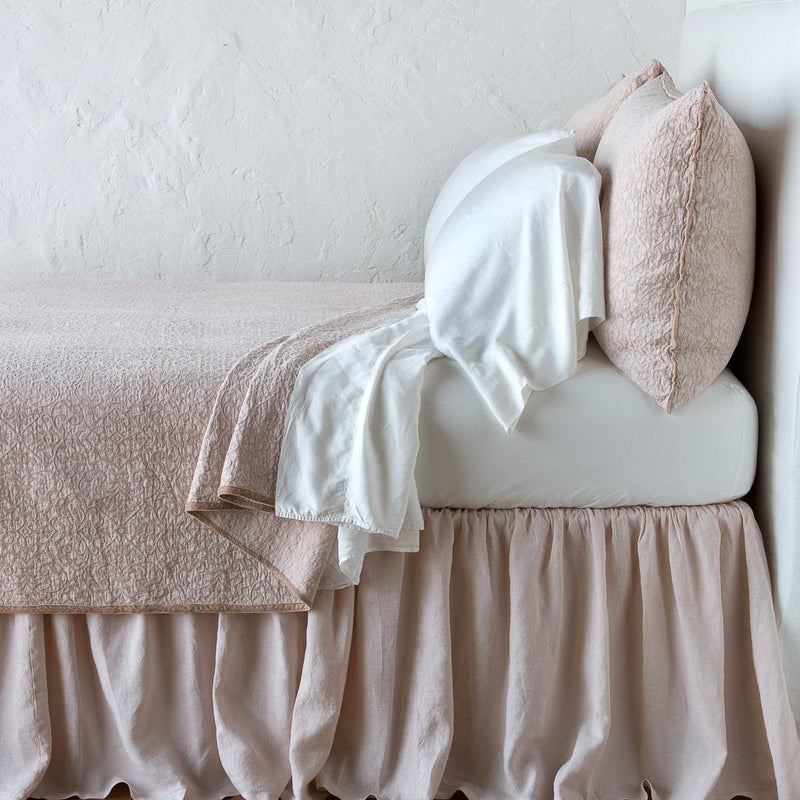 Pearl | Vienna coverlet and matching sham over white sheeting - pearl, side view.