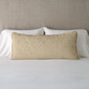 Vienna Throw Pillow | Honeycomb | 16x36 pillow leaning upright against white sleeping pillows on a neutral headboard.