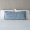 Vienna Throw Pillow | Mineral | Vienna 16x36 pillow leaning upright against white sleeping pillows on a neutral headboard - mineral.