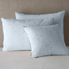 Vienna Sham | Cloud | Cotton chenille jacquard shams leaning upright against a neutral headboard.