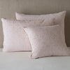 Vienna Sham | Pearl | Cotton chenille jacquard shams leaning upright against a neutral headboard.